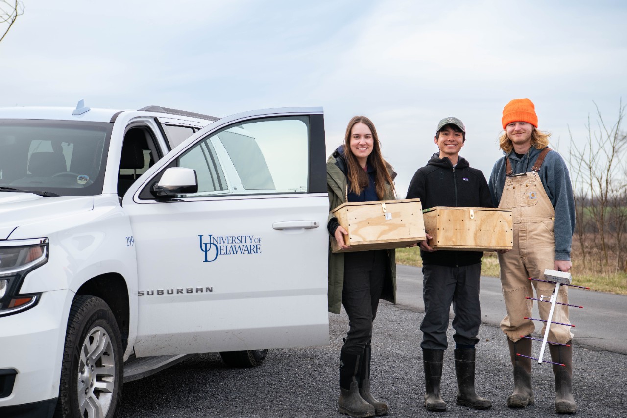 Graduate students Kai Victor and Grace Muench work closely with groups participating in the reintroduction plan, including collaborating with Will Krohn (right), a technician at Letterkenny Army Depot assisting with habitat management and tracking. 