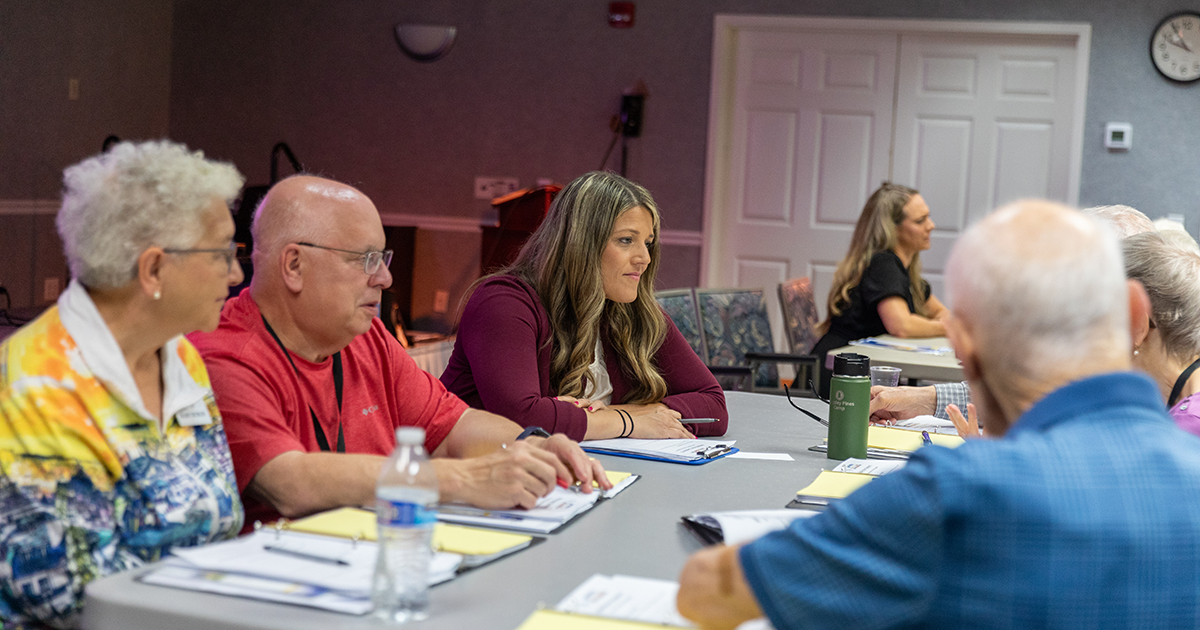 Residents of Jenner's Pond in West Grove, Pennsylvania, discuss hearing health in small groups in a workshop led by UD's Delaware Center for Cognitive Aging Research and the Speech-Language-Hearing Clinic