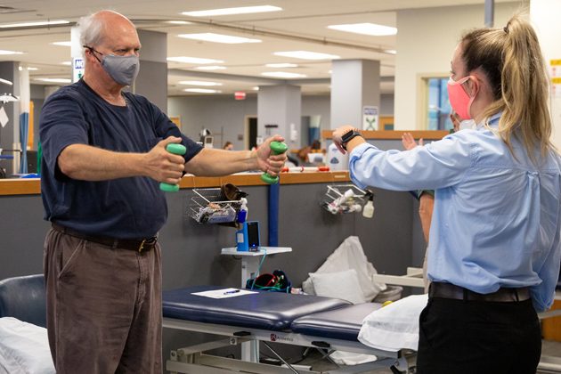 Clinicians and physical therapy students treat patients during COVID-19, following their new protocol for social distancing and wearing double layers of masks. The PT Clinic hit its 6,000th visit during November 2020. 