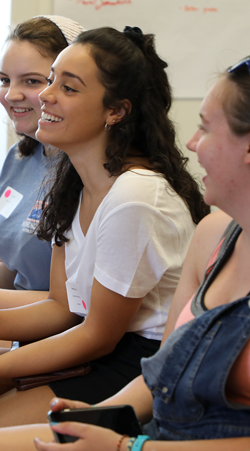 A student smiles during an iHouse event.