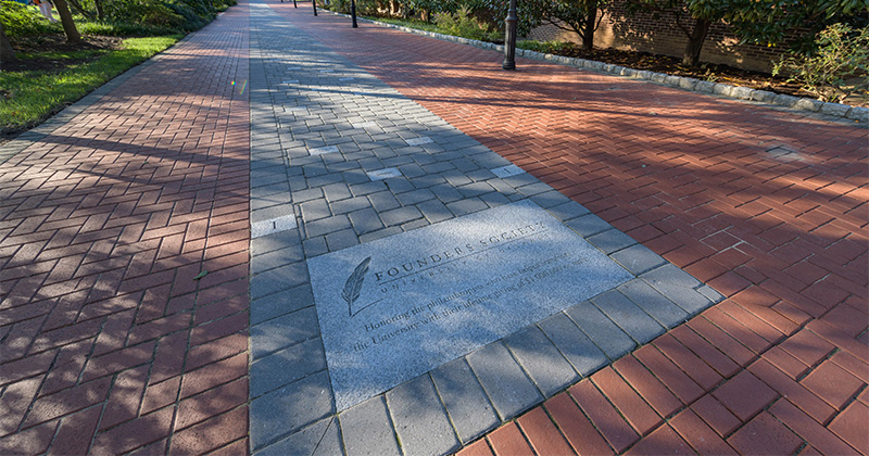 Close up photograph of the Founder's Walkway near the Amy DuPont Hall.