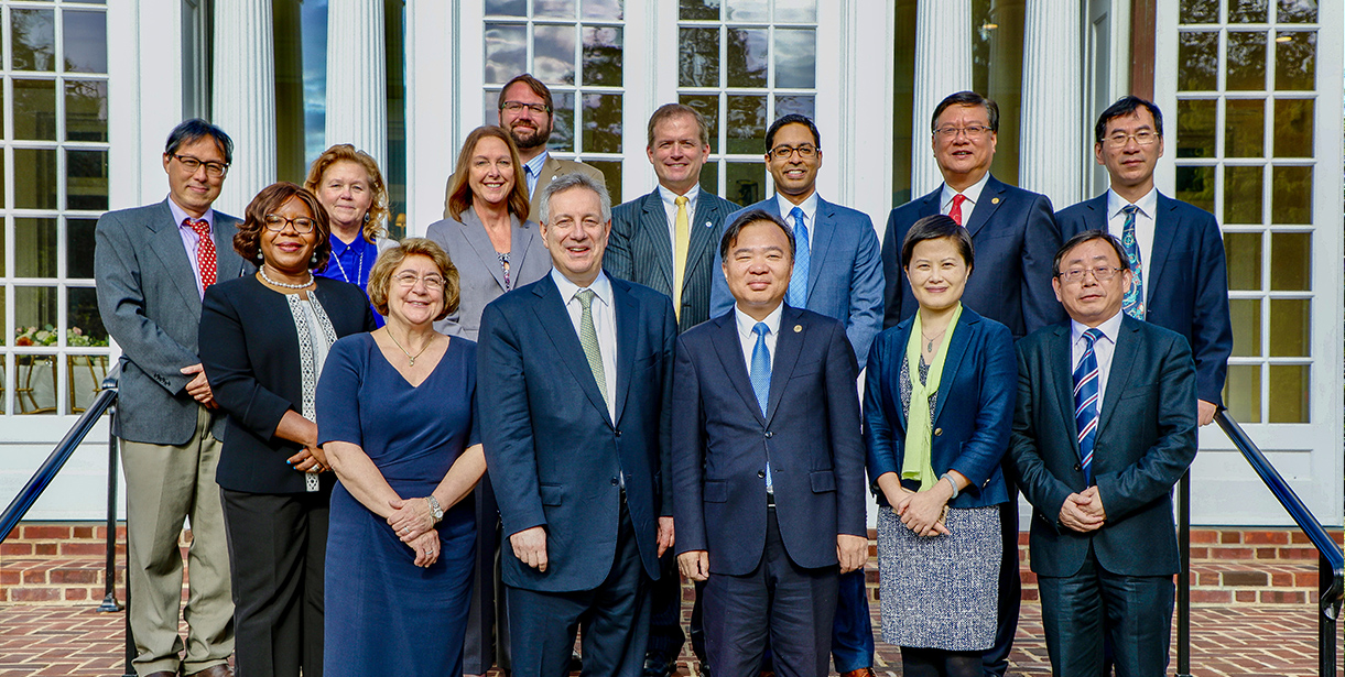UD's President Dennis Assanis stands with a delegation of faculty, staff and representatives from Xiamen University. 