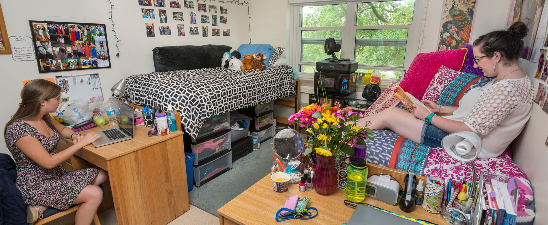 Students studying in a decorated residence hall room