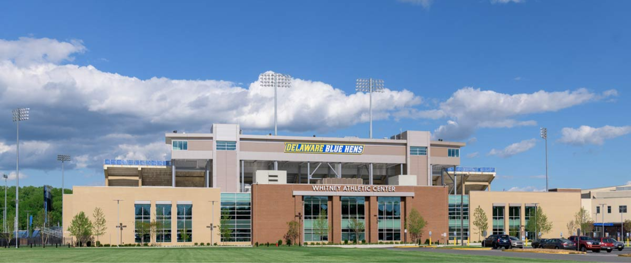 exterior view of Whitney Athletic Center under a Delaware Blue Hens logo