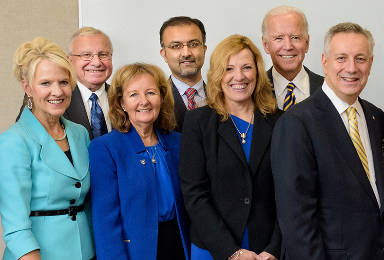 Celebrating the new Partnership for Healthy Communities are (from left) Delaware Lt. Gov. Bethany Hall-Long; Dan Rich, director of the UD Community Engagment Initiative; Kathy Matt, dean of the College of Health Sciences; Omar Khan, president and CEO of the Delaware Health Sciences Alliance; Rita Landgraf, director of the new partnership; Joe Biden, founding chair of the Biden Institute; and UD President Dennis Assanis.