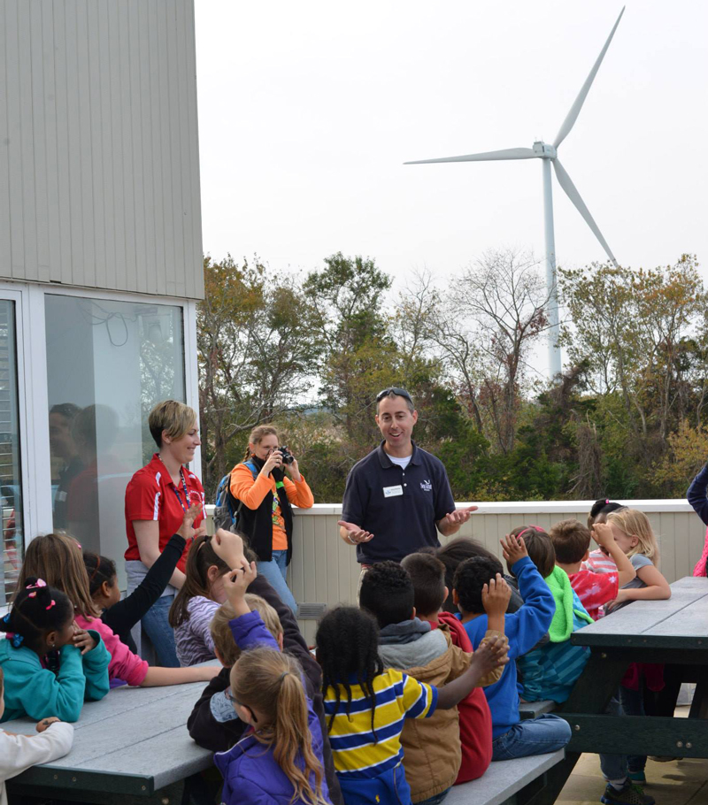 First graders from Smyrna Elementary school learn about wind energy from Delaware Sea Grant marine education specialist Chris Petrone.