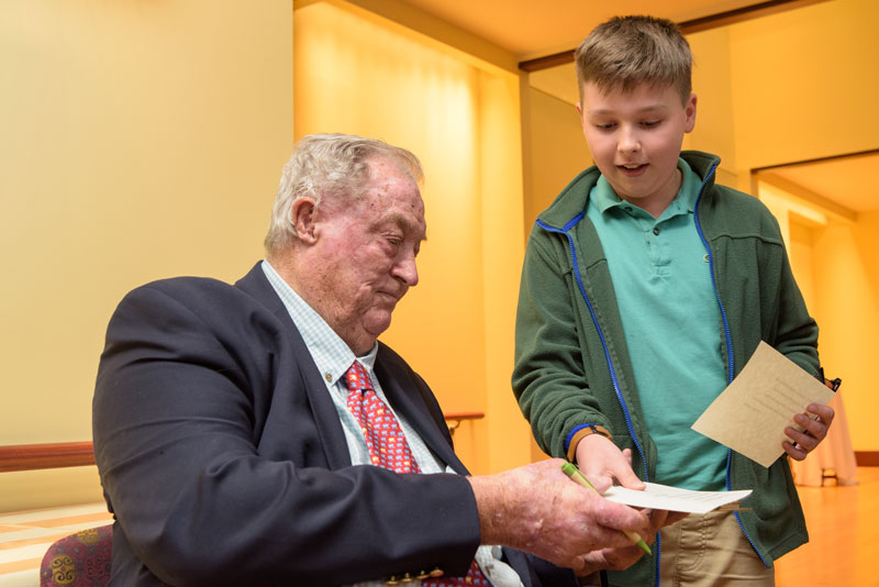 paleoanthropologist Richard Leakey signs autograph