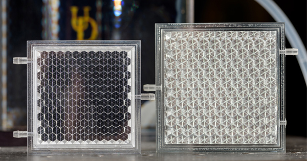 Keith Goossen, a UD associate professor, is designing new prototypes of smart glass panels, like the two shown here.