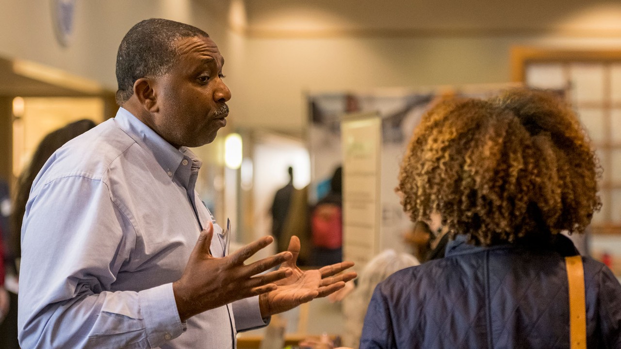 Supplier speaks to a prospective client at a supplier diversity conference
