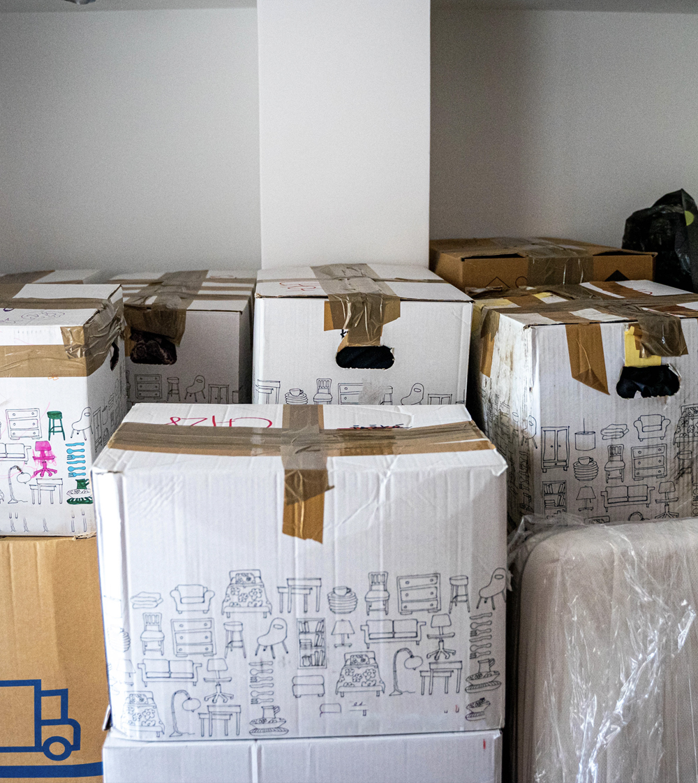 stacks of moving boxes in an apartment