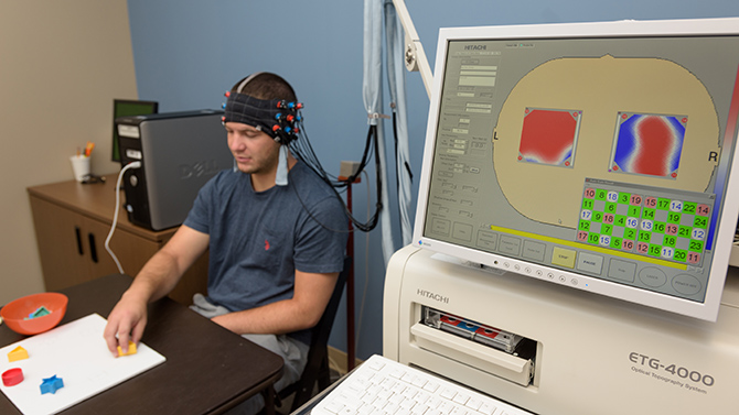 Dr. Anjana Bhat is an associate professor
Department of Physical Therapy who has started employing functional near-infrared spectroscopy (fNIRS) data collection in her research at the Nurse Managed Primary Care Center at UD's Health Sciences Complex. fNIR is a non-invasive imaging technique which can measure brain activity through changes in localized blood flow; taking advantage of the relative transparency of  skin, tissue, and bone to certain wavelengths of near-infrared light while hemoglobin is mostly opaque to those same wavelengths. - (Evan Krape / University of Delaware)