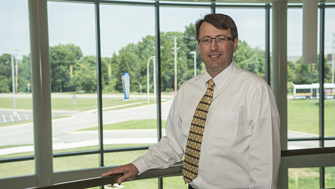 Portraits of CHS associate dean for research Adam Davey