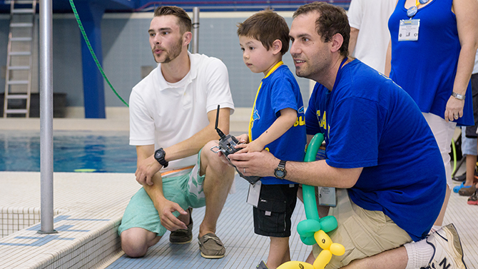 Alumni Weekend 2016 - College of Earth, Ocean, and Environment's "Under the Sea: Meet the Robotic Fleet" showcase held at the indoor pool in the Carpenter Sports Building. The event featured active and static demonstrations of various Remotely Operated Vehicles (ROVs) and Autonomous Underwater Vehicles (AUVs) and gave visits the chance to try piloting a tethered ROV. - (Evan Krape / University of Delaware)