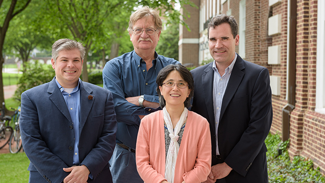 Joe Fox, professor of chemistry and biochemistry; Xinqiao Jia, associate professor of materials science and engineering, Colin Thorpe, professor of chemistry and biochemistry; Joel Rosenthal, associate professor of chemistry and biochemistry; and a few of their grad students. Photographed for a UDaily article. - (Evan Krape / University of Delaware)