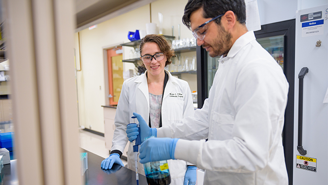 Megan L. Killian, assistant professor in the Biomedical Engineering department and head of the Musculoskeletal Development and Rehabilitation Laboratory, along with graduate students Michael Sonnenfelt, Ryan Locke, and Connor Leek. Professor Killian's group is researching topics related to tendon, cartilage, and bone development and growth, how mechanical loads and biomolecular cues influence healing, and mechanisms which regulate growth and healing of fibrocartilage.  - (Photographic Services / University of Delaware)