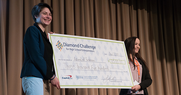 Diamond Challenge third place winners for the social innovation track, AutumnLeaf Fundraisers, pose with their prize. 