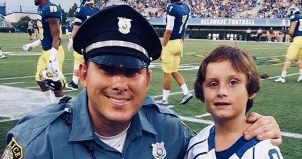 Danny Feltwell (right) joins Detective Bill Wentz on the sidelines at a UD football game.