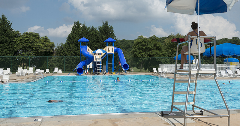 Kids cooling off from the summer heat by playing the UD outdoor pool.
