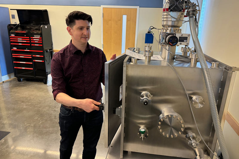 Bennett Maruca, associate professor of physics and astronomy, has a new thermal vacuum chamber in the Delaware Space Observatory Center he directs. The instrument makes it possible for University of Delaware students to develop and test CubeSat research satellites for a 2026 NASA launch.