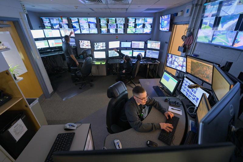 UD Police Department dispatchers Lacy Vible (foreground), Shahzaib Masood and Shelby Ricketts review the systems in UDPD’s Communication Center — one of only six university law enforcement agencies in the country to be accredited through the Commission on Accreditation for Law Enforcement Agencies (CALEA).