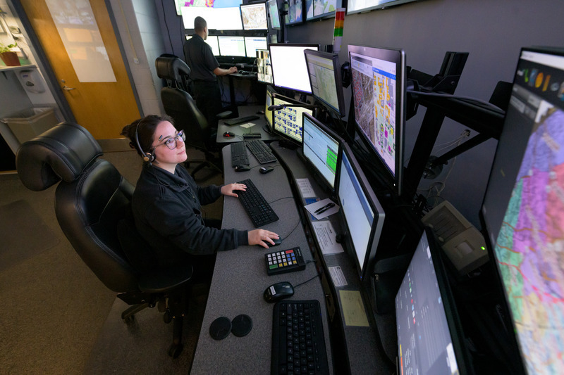 Shelby Ricketts, a UD Police Department dispatcher, views computer-aided dispatch and mapping systems in UDPD’s Communication Center. The Comm Center is staffed 24 hours a day, seven days a week, for 365 days each year.