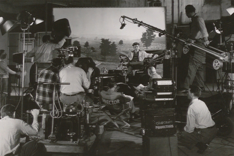 A production photo from a typical Cinecraft film. The studio was a pioneer in the use of teleprompters and filming using a multi-camera setup. Using two or more cameras with teleprompters to simultaneously film the same scene from different angles cut production costs tremendously.
