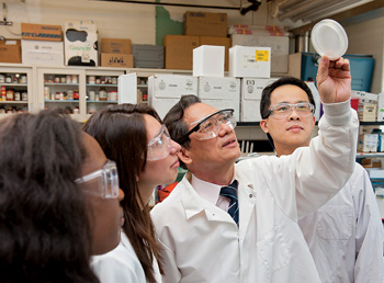 From left, Nagwa Nukuna, Lorraine Salamanca, C.P. Huang and Poyen Wang in lab at UD