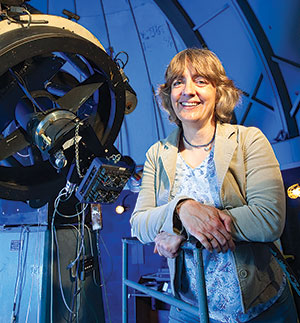 Judy Provencal in front of telescope