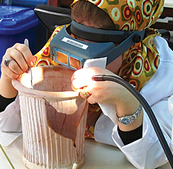 Iraqi woman working on vase