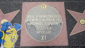 paper cut out of YoUDEE at Apollo XI plaque
