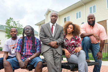 PAR members (from left to right) Derrick Chambers, Patrice Gibbs, Prof. Payne, Ashley Randolph and Darryl Chambers, AS14M, at a housing project 
in Wilmington.