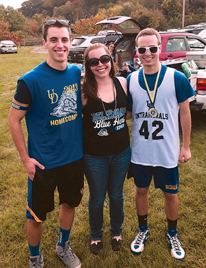 Claire Griffiths (center) at the 2014 Homecoming tailgate with her friend Tommy Margiasso (left),  EG16, and brother Brian, EG16.