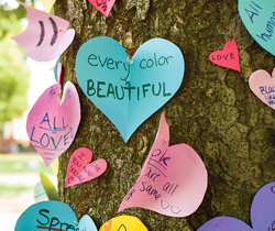 messages on cut out hearts pinned to a tree