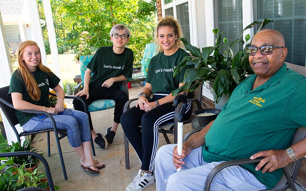 Thomas Henry, 85, meets with Lori's Hands volunteers at his Newark home. He has his helpers do small chores around the house and keep him company by talking on the porch when it's nice outside. 

Students pictured are Krista Szymanski (red hair), Class of 2019, exercise science; Tong Xie, Class of 2020, economics; Ashley Sullivan, Class of 2020, elementary education.