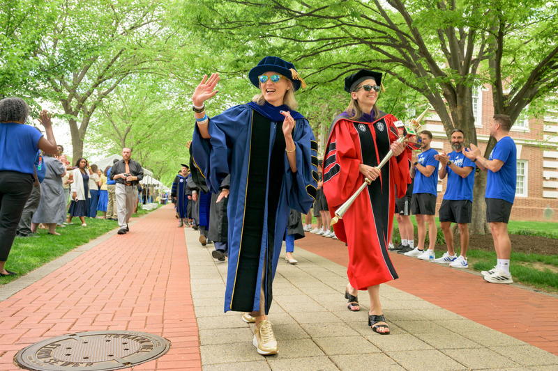 Laura Carlson (left) was formally inaugurated as the University of Delaware’s 29th president in a tradition-filled ceremony on The Green on Friday, April 17. Angela Downin (right), vice president, general counsel and university secretary, carries the University’s mace, a symbol of power and authority that signifies the dignity of an institution.