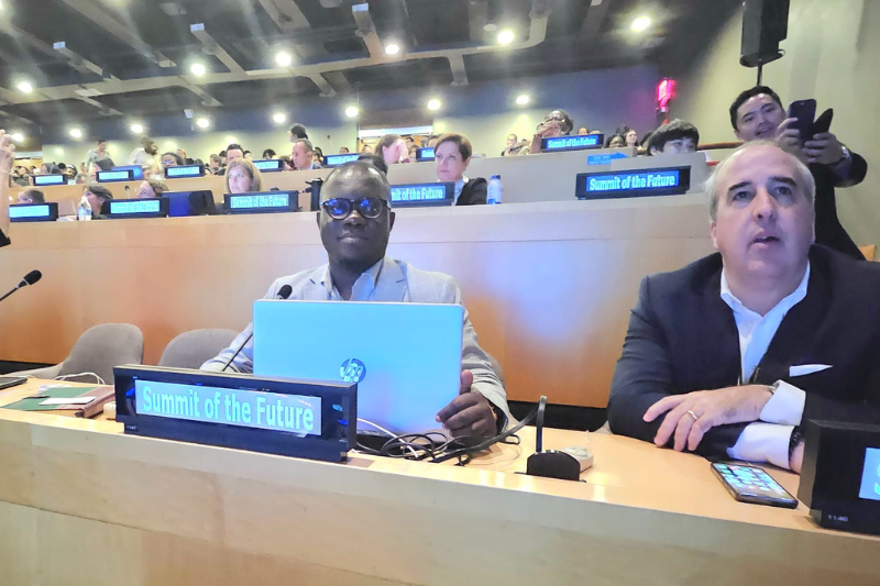 UN Summit of the Future Adults fill rows of seating with microphones and name signs