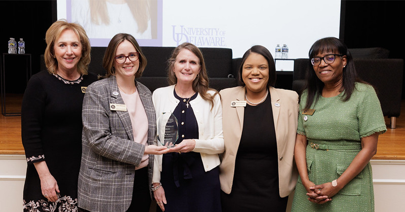 Photo of Nicole Minni (center) and UD members of the DAWN Executive Committee (pictured here from left to right), Past-President Kathy Murphy, Sarah Marshall, Alaina Robinson and Secretary Joy Jordan.