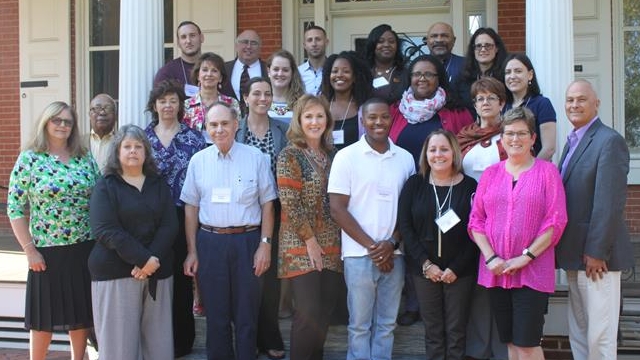 Basic Mediation Training graduates stand on the steps of the Buena Vista Conference Center