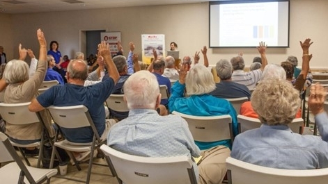 Image featuring IPA staff member Julia O’Hanlon co-presenting with Delaware Sea Grant partner Danielle Swallow at the Roxanna Fire Hall