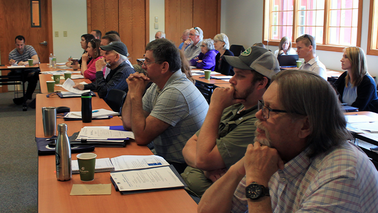 Local government staff seated in flood-readiness workshop