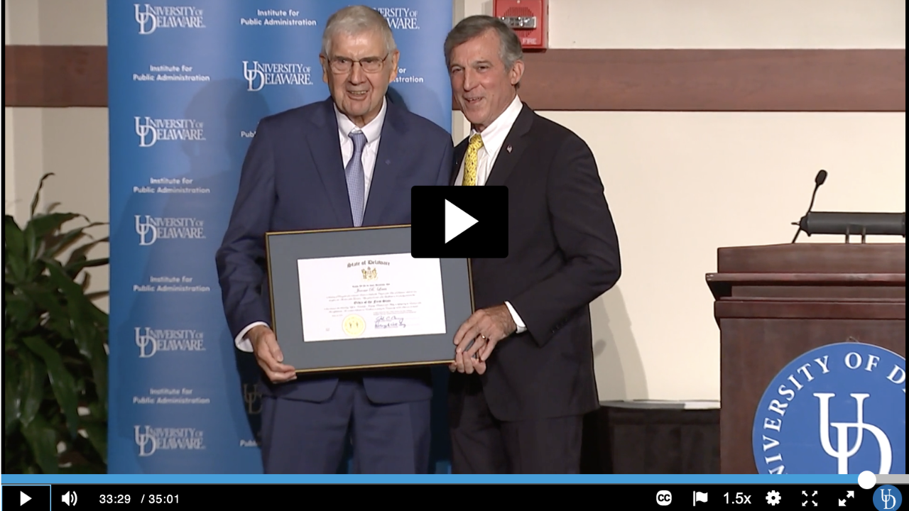 Screenshot of Event Recording showing Dr. Jerome Lewis receiving the First Order of the State from Governor John Carney