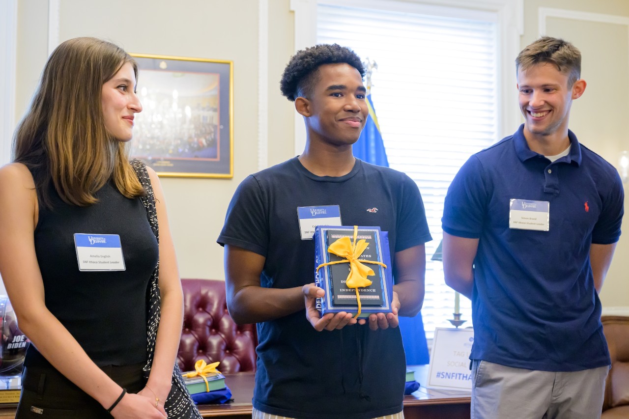 Photo of three past SNF Ithaca Student Leaders at a welcome reception event