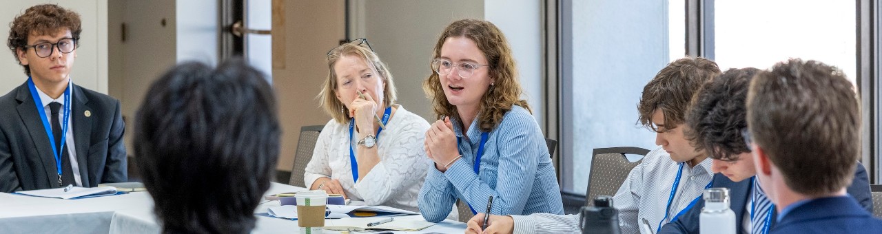 Students in discussion around a table