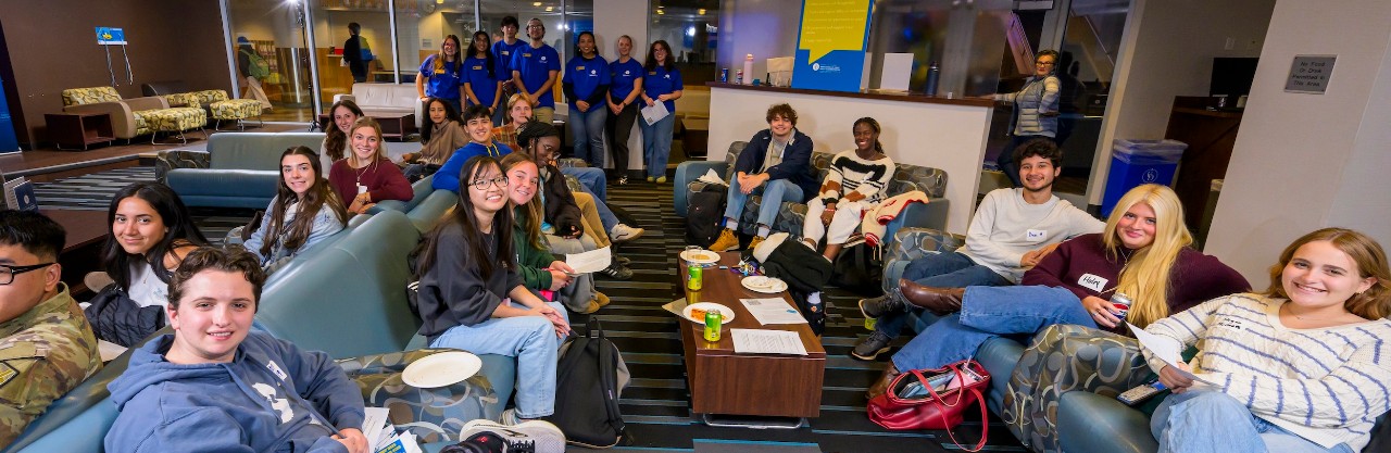 A room of students smiling at Campus Conversations
