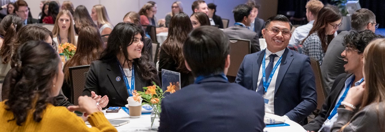 Students around a table at the National Student Dialogue