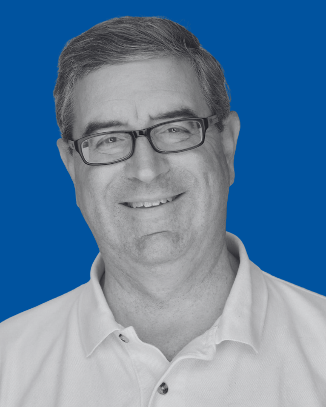 A black-and-white portrait of a person against a solid blue background