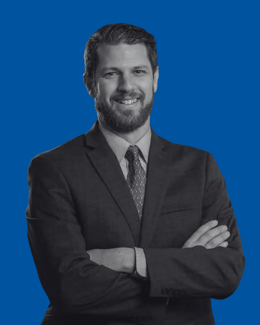 A black-and-white portrait of a person against a solid blue background