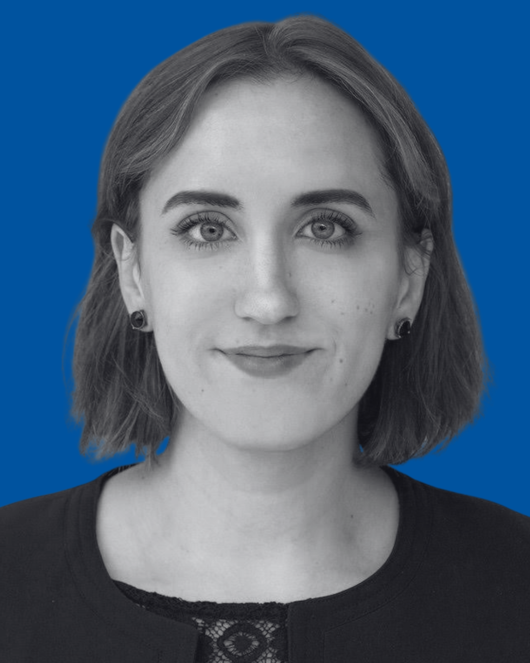 A black-and-white portrait of a person against a solid blue background