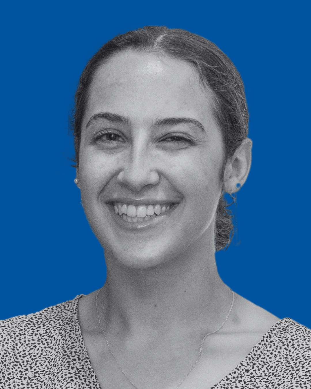 A black-and-white portrait of a person against a solid blue background