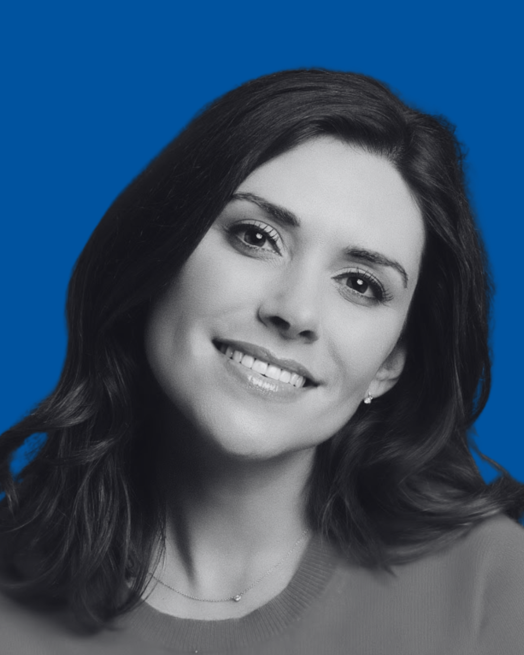 A black-and-white portrait of a person against a solid blue background